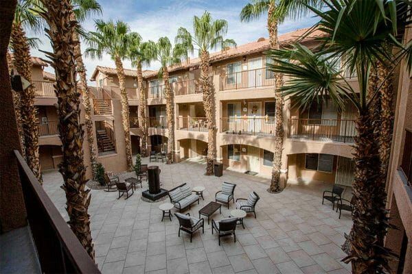 Court Senior Apartments' courtyard patio, which is overlooked by resident balconies on all sides