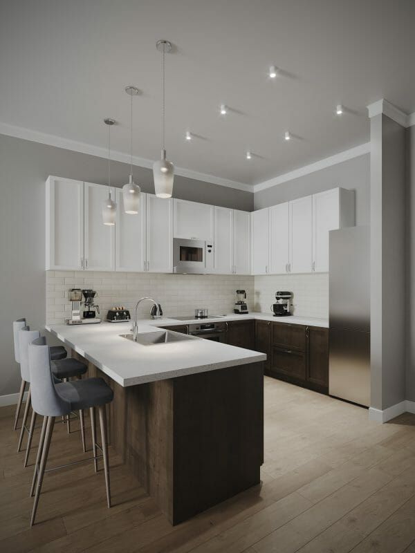 Hamilton Parc model home kitchen with barstools and pendant lighting
